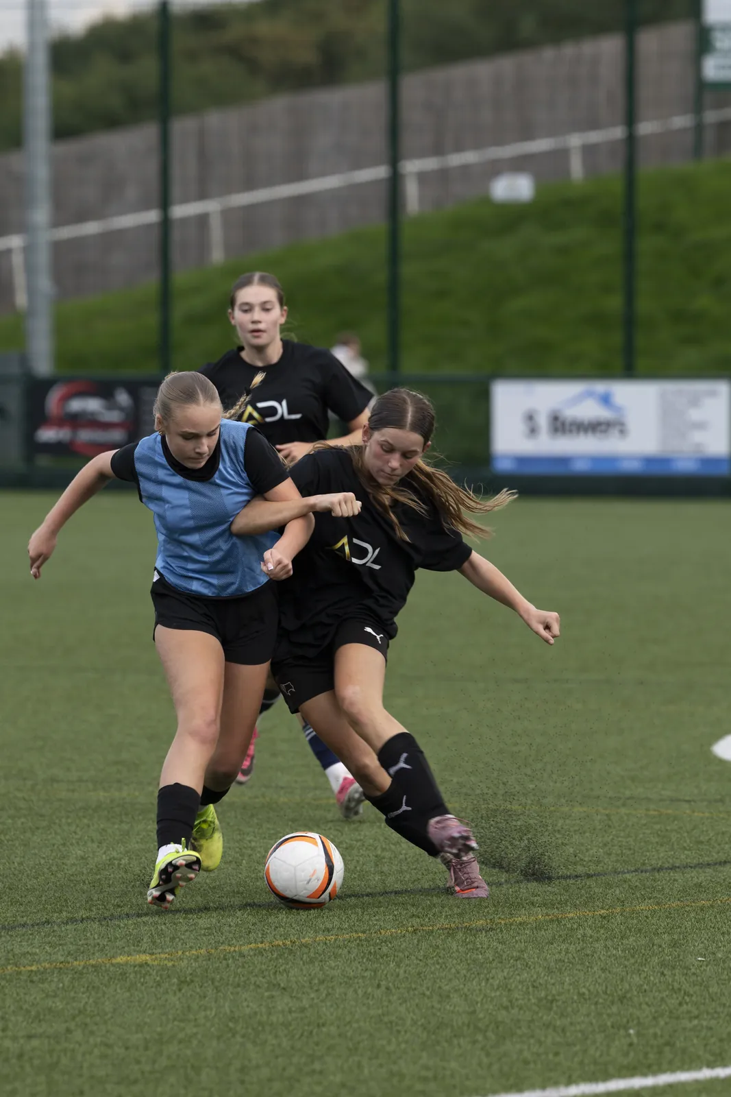 Two players contest the ball at ADL's girls showcase